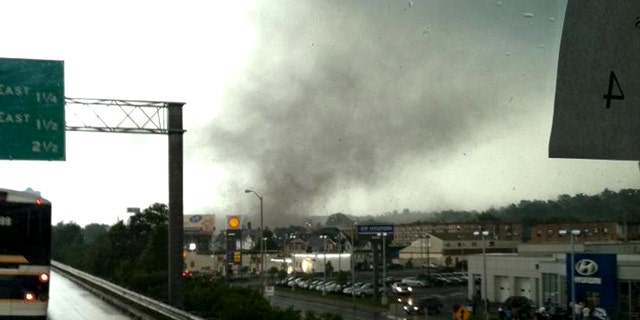 June 1, 2011: Traveling in a bus on Interstate Route 91, in Springfield, Mass., Michelle Gilbert photographed a funnel cloud that touched the ground in Springfield, Mass. causing widespread damage -- and the state's first tornado-related deaths in 16 years.