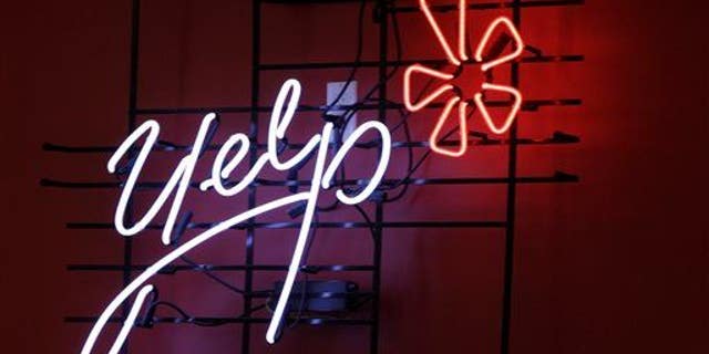 The logo of the online reviews website Yelp on a wall at the company's offices in New York.