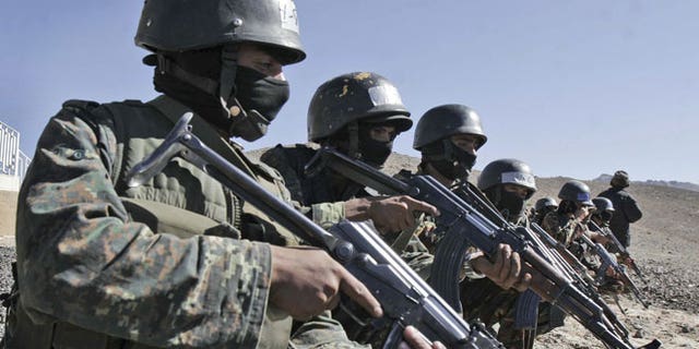 In this Wednesday, Jan. 6, 2010 file photo, an anti-terrorist unit from the Central Security Forces of the Ministry of Interior trains in the Sarif area on the eastern outskirts of the capital Sana, in Yemen.