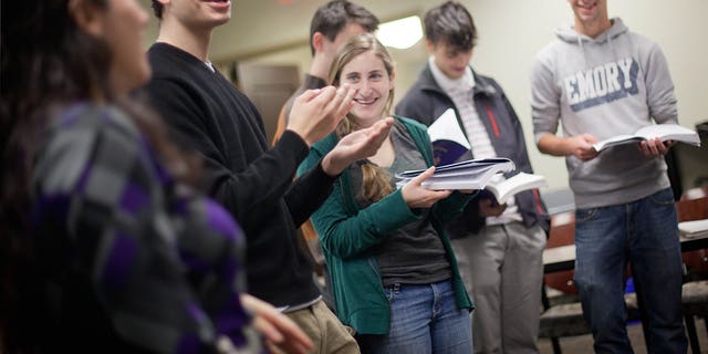 November 10: Matthew Birnbaum, 19, left, leads a class in singing a song during a Yiddish class at Emory University in Atlanta.