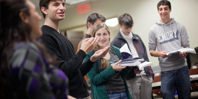 November 10: Matthew Birnbaum, 19, left, leads a class in singing a song during a Yiddish class at Emory University in Atlanta.