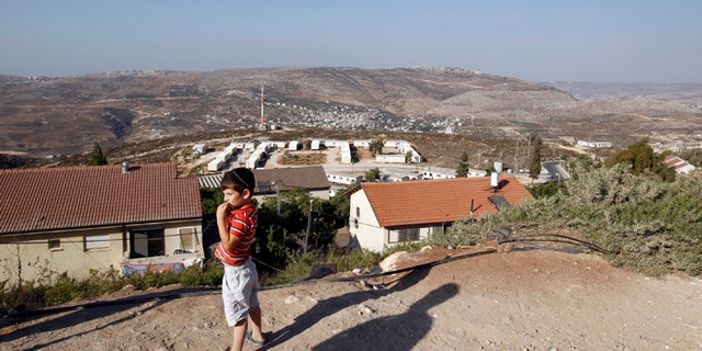 Sept. 20, 2010: A boy stands in the West Bank Jewish settlement of Yitzhar, south of Nablus.