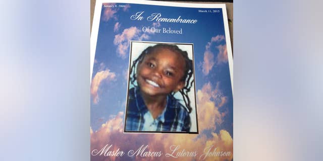 This image provided by Marcus Johnson Sr. shows Marcus Johnson Jr.'s funeral pamphlet. Marcus Johnson Jr.’s parents figured a sunny day at a city park was just what the 6-year-old kindergartner needed while recovering from heart surgery the previous week and a doctor’s visit that same day. Instead, his family will bury Marcus on Thursday, March 19, 2015, after the child was shot in the chest and killed in an attack his mother and father said stemmed from a traffic dispute. (AP Photo/Marcus Johnson Sr.)