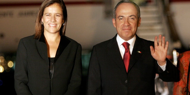 FILE - In this Jan. 13, 2008, file photo, Mexico's former president Felipe Calderon, right, accompanied by his wife Margarita Zavala, waves upon their arrival to a military airport in Guatemala City. Zavala announced on Sunday, June 14, 2015, her intention to run for president of Mexico in the 2018 elections. (AP Photo/Moises Castillo, File)