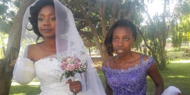 Zanele Ndlovu walked down the aisle wearing a one-shoulder white dress.