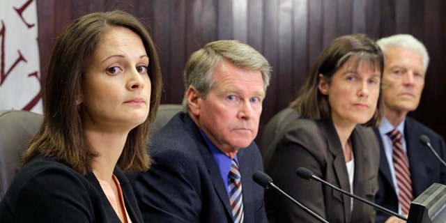 Left to right, Dr. Angela Dunn, deputy state epidemiologist at the Utah Department of Health; Gary Edwards, executive director, Salt Lake County Health Department; Dr. J. Erin Staples, Medical Epidemiologist, Centers for Disease Control and Prevention,and Dr. Edward Clark Associate Vice President Clinical Affairs University of Utah speak during a news conference Monday, July 18, 2016, in Salt Lake City. A person who cared for a Zika-infected relative in Utah also got the virus, but exactly how it was transmitted is a medical mystery, health officials announced Monday. (AP Photo/Rick Bowmer)