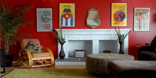 The red walls in this home were inspired by the homeowner’s art from Cuba.