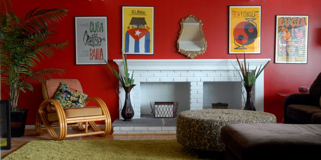 The red walls in this home were inspired by the homeowner’s art from Cuba.