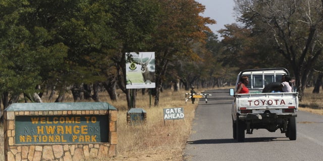 August 2, 2015 - Visitors arrive at Zimbabwe's Hwange National Park. After the killing of Zimbabwe's best known lion, a second animal has been poached by a foreigner, a source said on Saturday as authorities banned big game hunting outside the park from which Cecil was lured to his death.