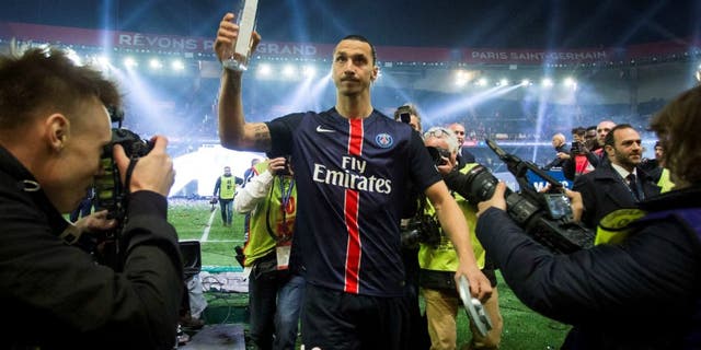PARIS, FRANCE - MAY 14: Paris Saint-Germain's Swedish forward Zlatan Ibrahimovic holds the trophy after winning the French L1 title at the end of the French L1 football match between Paris Saint-Germain (PSG) vs Nantes on May 14, 2016 at the Parc des Princes stadium in Paris, France. (Photo by Geoffroy Van der Hasselt/Anadolu Agency/Getty Images)