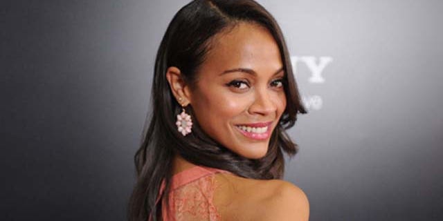 August 24, 2011: Actress Zoe Saldaña arrives at the screening of ' 'Colombiana' in Los Angeles, Calif.