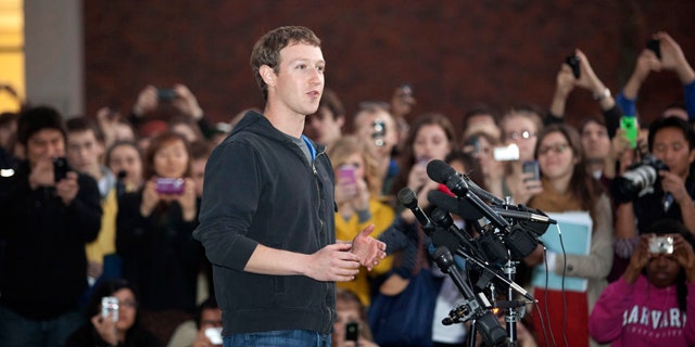 Nov. 7, 2011: Facebook creator Mark Zuckerberg speaks to students outside Lamont Library on the campus of Harvard University, in Cambridge, Mass.