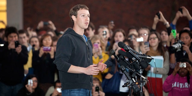 Nov. 7, 2011: Facebook creator Mark Zuckerberg speaks to students outside Lamont Library on the campus of Harvard University, in Cambridge, Mass.