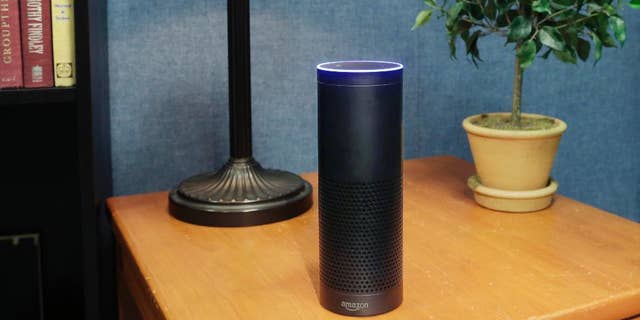 FILE - This July 29, 2015, file photo made in New York shows Amazon's Echo, a digital assistant that continually listens for commands such as for a song, a sports score or the weather. (AP Photo/Mark Lennihan, File)