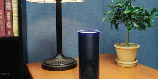 FILE - This July 29, 2015, file photo made in New York shows Amazon's Echo, a digital assistant that continually listens for commands such as for a song, a sports score or the weather. (AP Photo/Mark Lennihan, File)