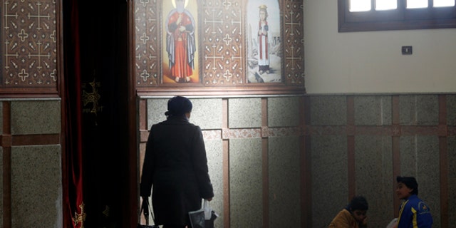 A Christian family from Al-Arish city takes a rest after arriving inside the Saint Church in Ismailia, northeast of Cairo, Egypt.