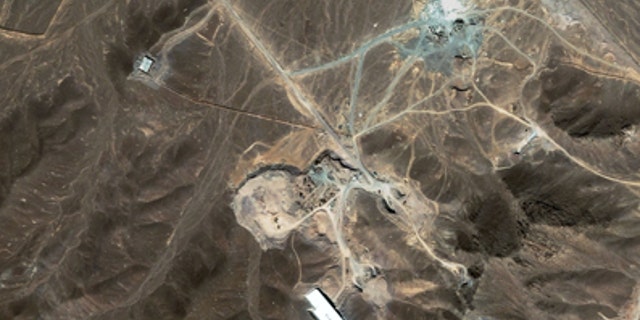 A file satellite image taken Sunday Sept. 27, 2009, provided by DigitalGlobe, shows a suspected nuclear enrichment facility under construction inside a mountain located north of Qom, Iran. Critical nuclear talks between Iran and world powers could begin this week in an atmosphere of impasse.