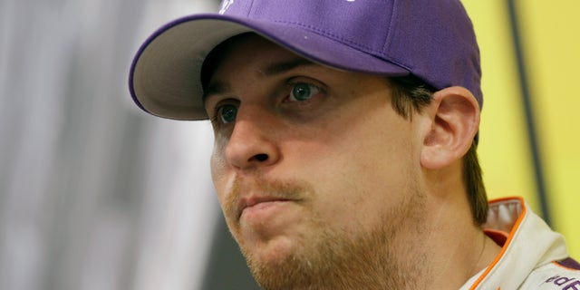 NASCAR Sprint Cup series driver Denny Hamlin talks to the media after practice for Sunday's auto race at the Martinsville Speedway in Martinsville, Va., Friday, Oct. 25, 2013. (AP Photo/Steve Helber)