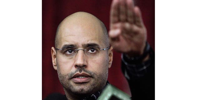 March 10, 2011: Seif al-Islam Qaddafi, son of Libyan leader Muammar Qaddafi, gestures as he speaks to supporters and the media in Tripoli, Libya.