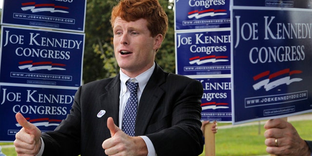 Joseph Kennedy III, son of former U.S. Rep. Joseph P. Kennedy II and grandson of the late Robert F. Kennedy gestures while visiting voters outside a polling station at a school in Needham, Mass., Thursday, Sept. 6, 2012. The 31-year-old Kennedy is vying for the House seat being vacated by Democratic U.S. Rep. Barney Frank. (AP Photo/Steven Senne)