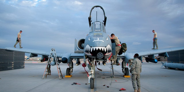 Members of the 451st Expeditionary Maintenance Group perform a recovery on an A-10 Warthog at Kandahar Airfield, Afghanistan, Sept. 2, 2011.