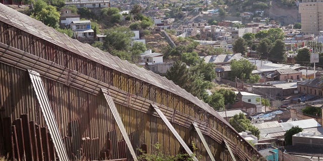 NOGALES, AZ - JUNE 02: A fence separates the cities of Nogales, Arizona and Nogales, Sonora Mexico, a frequent crossing point for people entering the United States illegally, June 2, 2010 in Nogales, Arizona. During the 2009 fiscal year 540,865 undocumented immigrants were apprehended entering the United States illegally along the Mexican border, 241,000 of those were captured in the 262 mile stretch of the border known as the Tucson Sector. (Photo by Scott Olson/Getty Images)