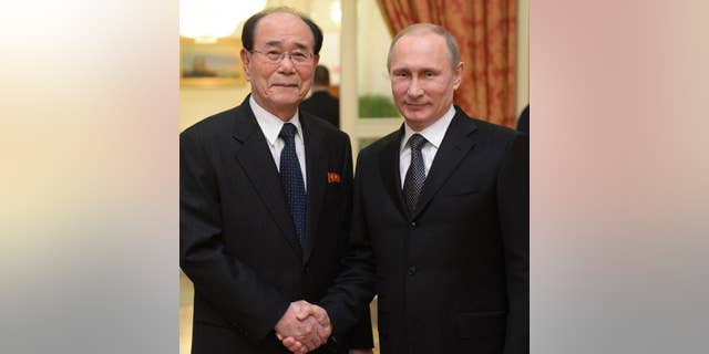 Russian President Vladmir Putin with the president of the Presidium of North Korea's Supreme People's Assembly Kim Yong Nam.
