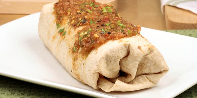 delicious mexican famous burrito with hot sauce
