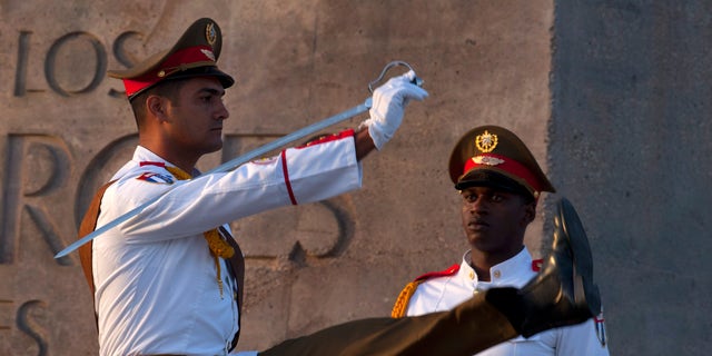 Honor guards attend celebrations marking Revolution Day in Guantanamo, Cuba.