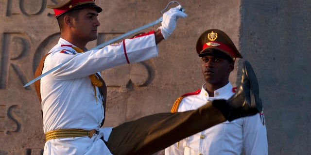 Honor guards attend celebrations marking Revolution Day in Guantanamo, Cuba.