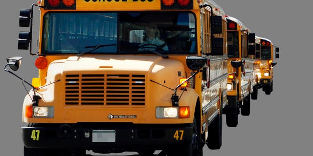 About 50 buses from Falcon School District 49 circled the state Capitol on Thursday March 31, 2011, with messages for lawmakers considering cutting education funding. The messages included "NO CUTS" and "DRIVING OUR FUTURE." (AP Photo/Ed Andrieski)