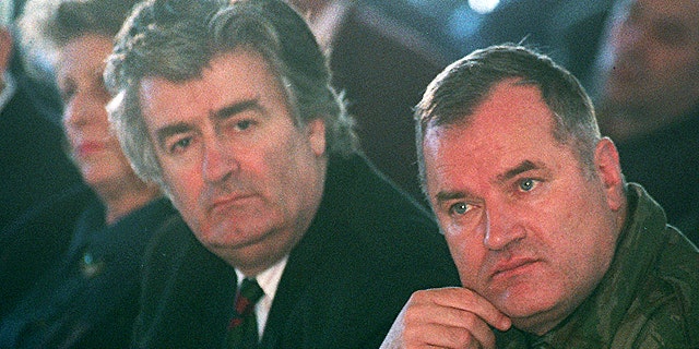 An undated file photo shows top war crimes fugitives Bosnian Serb wartime military commander Ratko Mladic, right, and political leader Radovan Karadzic. (AP/Srdjan Ilic)