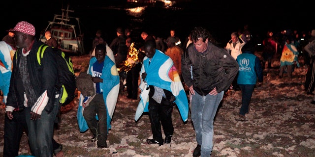 May 8: Migrants arrive on the tiny island of Lampedusa, Italy.
