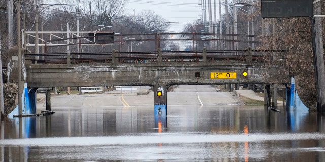Pennsylvania Avenue at the Potter Park Zoo entrance is still closed due to flooding, Saturday, Feb. 24, 2018 in Lansing, Mich.