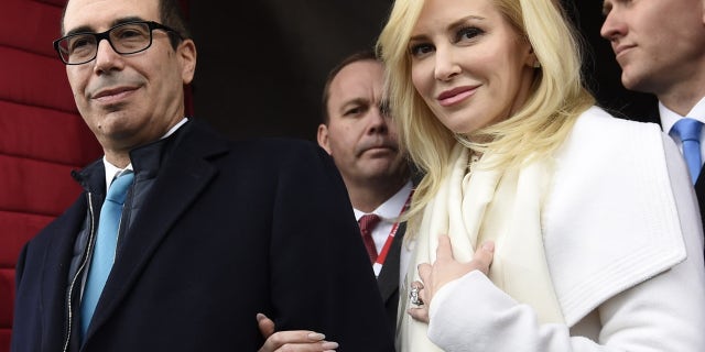 FILE: Treasury Secretary Steven Mnuchin and his wife, Louise Linton in Washington