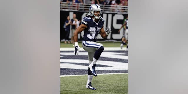 In this Sept. 21, 2014, photo, Dallas Cowboys' C.J. Spillman warms up for the Cowboys' NFL football game against the St. Louis Rams in St. Louis. Spillman is under investigation but hasn't been arrested or charged after a report of an alleged sexual assault at the team hotel last month. Grapevine, Texas, police spokesman Sgt. Robert Eberling said Wednesday night, Oct. 1, that the alleged incident took place early the morning of Sept. 20 at the Gaylord Texan Resort and Convention Center. Spillman's agent and attorney declined to comment. (AP Photo/Tom Gannam)