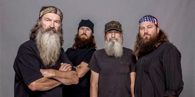 This 2012 photo released by A&E shows, from left, Phil Robertson, Jase Robertson, Si Robertson and Willie Robertson from the A&E series, 'Duck Dynasty.'