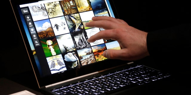 File photo: Feb. 21, 2013: A man uses the Google Chromebook Pixel laptop computer after an announcement in San Francisco. (AP Photo/Jeff Chiu)