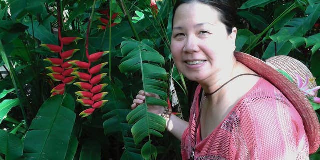 This undated photo provided by Jeff Gillis shows his wife, Phan "Sandy" Phan-Gillis. (Courtesy of Jeff Gillis via AP)