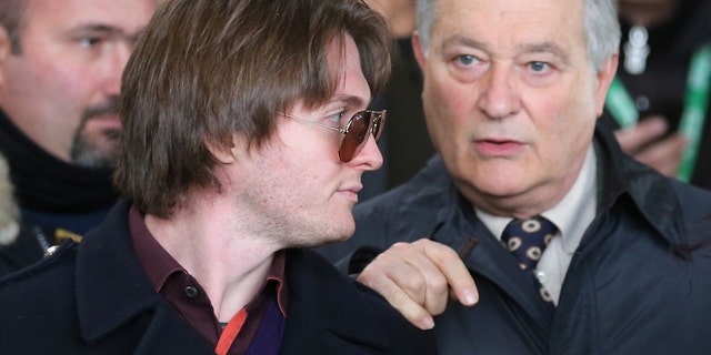 Raffaele Sollecito, left, and his father Francesco leave after attending the final hearing before the third court verdict for the murder of British student Meredith Kercher, in Florence, Italy, Thursday, Jan. 30, 2014. The first two trials produced flip-flop verdicts of guilty then innocent for Kercher former roommate, American student Amanda Knox, who is not attending the hearing, and her former Italian boyfriend, Raffaele Sollecito, and the case has produced harshly clashing versions of events. A Florence appeals panel designated by Italy's supreme court to address issues it raised about the acquittal is set to deliberate Thursday, with a verdict expected later in the day. (AP Photo/Antonio Calanni)