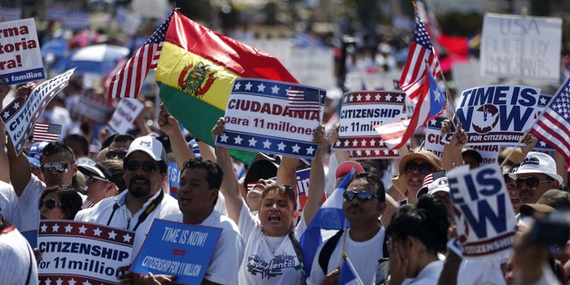 Activists participate in a rally for immigration reform on Capitol Hill in Washington, Wednesday, April 10, 2013, where tens of thousands of immigrants and their supporters are expected to rally for immigration reform. Bipartisan groups in the House and Senate are said to be completing immigration bills that include a pathway to citizenship for the nation's 11 million immigrants with illegal status. (AP Photo/Charles Dharapak)