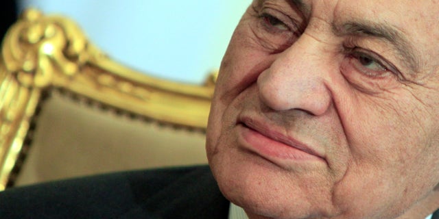 FILE - In this Tuesday, Feb. 8, 2011 file photo, the Egyptian President Hosni Mubarak sits during his meeting with Emirates foreign minister, not pictured, at the Presidential palace in Cairo, Egypt. Egypt’s state news agency says the country’s top prosecutor has ordered ousted President Hosni Mubarak be detained for 15 days pending investigation into a new case of corruption by him and his family for pocketing state funds slated for the presidential palaces. Mubarak, 84, in detention since April 2011, is currently held in a military hospital because of health issues. (AP Photo/Amr Nabil, File)
