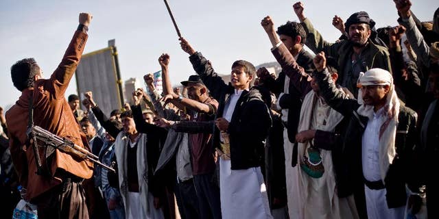 Houthi Shiite Yemenis chant slogans during a rally to show support for their comrades in Sanaa, Yemen, Wednesday, Jan. 28, 2015. Rebels who control the Yemeni capital have beaten back dozens of people marching in protest against them, firing automatic rifles in the air and striking protesters with batons and knives. (AP Photo/Hani Mohammed)