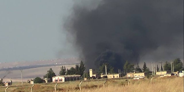 May 17, 2013: Black smoke rises from what rebels say is a helicopter that was shot down at Abu Dhour military airbase which is besieged by the rebels, in the northern province city of Idlib, Syria.
