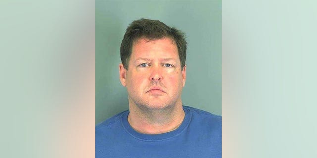 FILE - This photo made available by the Spartanburg, S.C., County Sheriff's Office shows Todd Kohlhepp of Moore, S.C. A woman who police say was locked in a storage container for two months by Kohlhepp, who is charged with killing seven people, is suing her alleged captor. The woman sued Wednesday, Nov. 30, 2016, in Spartanburg County, where authorities say Kohlhepp kidnapped her on Aug. 31 after talking to her and her boyfriend about hiring them to clean up his property (Spartanburg County Sheriff's Office via AP, File)