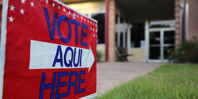 AUSTIN, TX - APRIL 28:  A bilingual sign stands outside a polling center at public library ahead of local elections on April 28, 2013 in Austin, Texas. Early voting was due to begin Monday ahead of May 11 statewide county elections. The Democratic and Republican parties are vying for the Latino vote nationwide following President Obama's landslide victory among Hispanic voters in the 2012 election.  (Photo by John Moore/Getty Images)