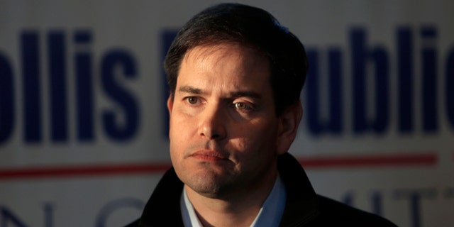 Possible 2016 Republican presidential hopeful, U.S. Sen. Marco Rubio of Florida listens to questions as he speaks to area residents, Monday, Feb. 23, 2015, in Hollis, N.H. (AP Photo/Jim Cole)