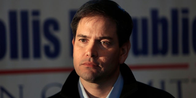 Possible 2016 Republican presidential hopeful, U.S. Sen. Marco Rubio of Florida listens to questions as he speaks to area residents, Monday, Feb. 23, 2015, in Hollis, N.H. (AP Photo/Jim Cole)