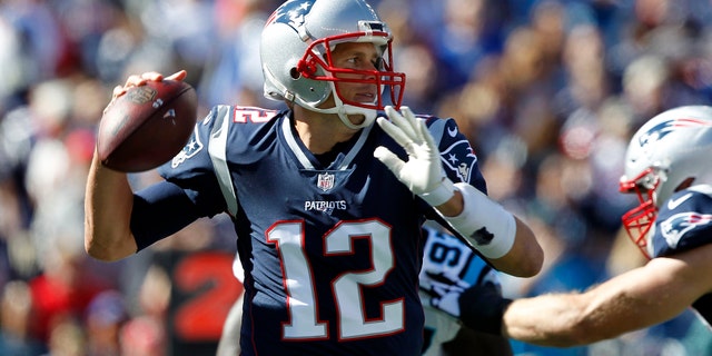 File photo - New England Patriots quarterback Tom Brady passes the ball during the first quarter against the Carolina Panthers at Gillette Stadium on Oct 1, 2017. (Stew Milne-USA Today Sports)