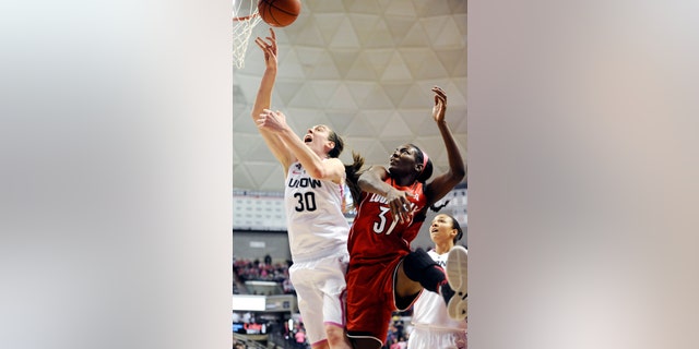 Connecticut's Breanna Stewart, left, and Louisville's Asia Taylor, battle for a rebound during the second half of an NCAA women's college basketball game, Sunday, Feb. 9, 2014, in Storrs, Conn. Connecticut won 81-64. (AP Photo/Jessica Hill)